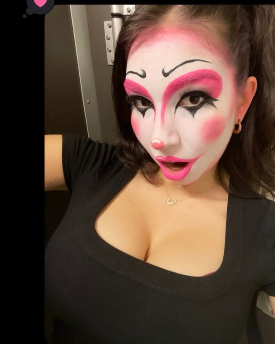 Cute spooky pink clown Halloween makeup with graphic liner